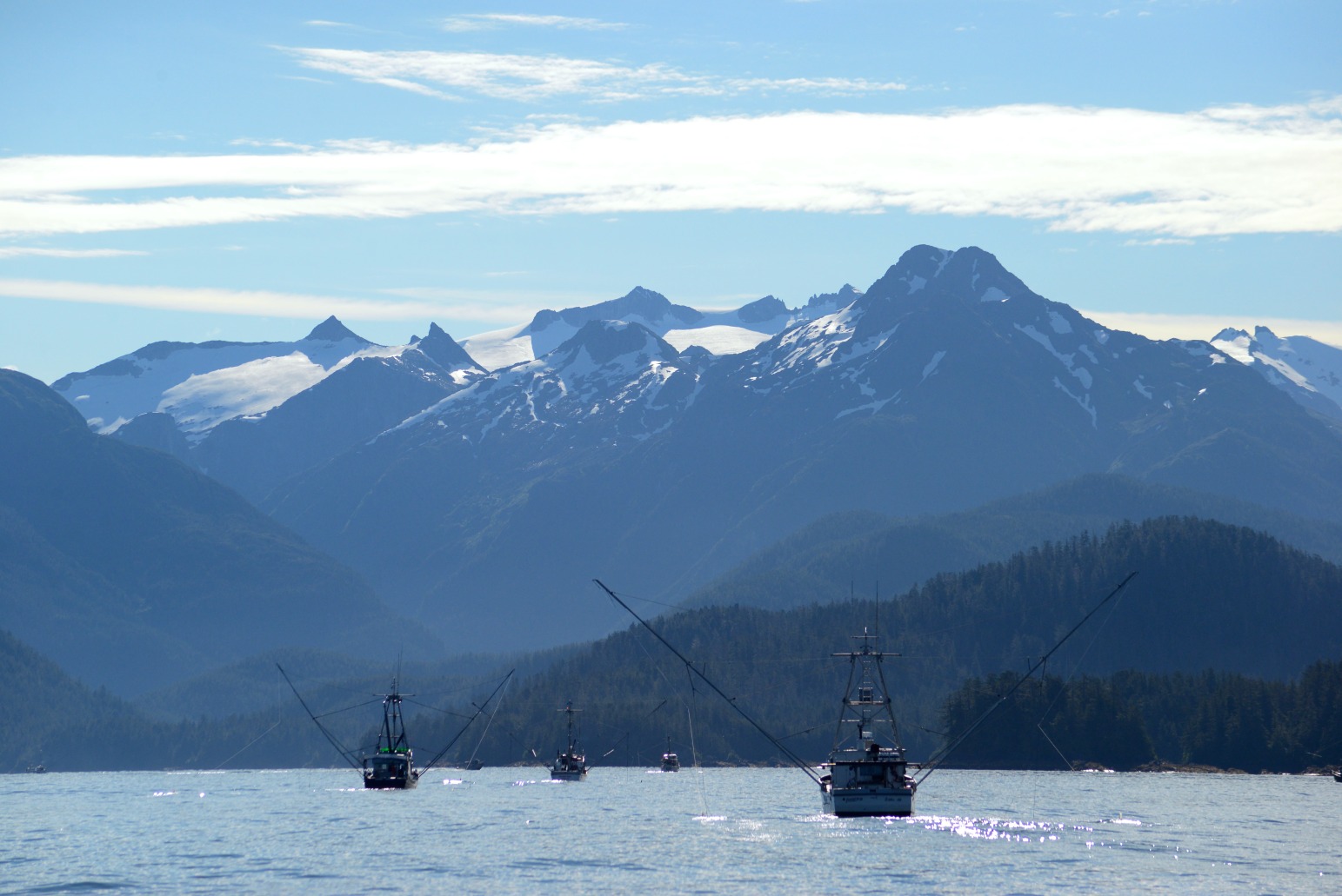 Trollers in front of a mountain in Sitka Alaska